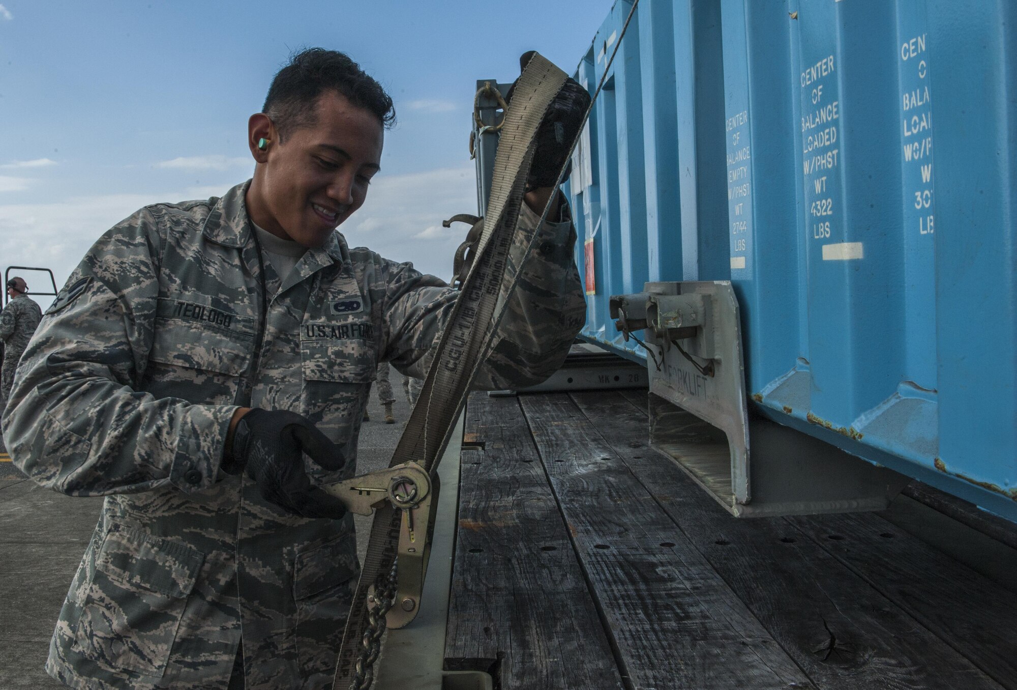 U.S. Air Force Airman 1st Class Ryan Teologo, a munitions storage crew member with the 18th Munitions Squadron, secures mock munitions for transport to a storage area Oct. 30, 2016, at Kadena Air Base, Japan. With operations such as these, the 18th MUNS is able to demonstrate the truly broad range of capabilities they have. (U.S. Air Force photo by Airman 1st Class Nick Emerick /Released)