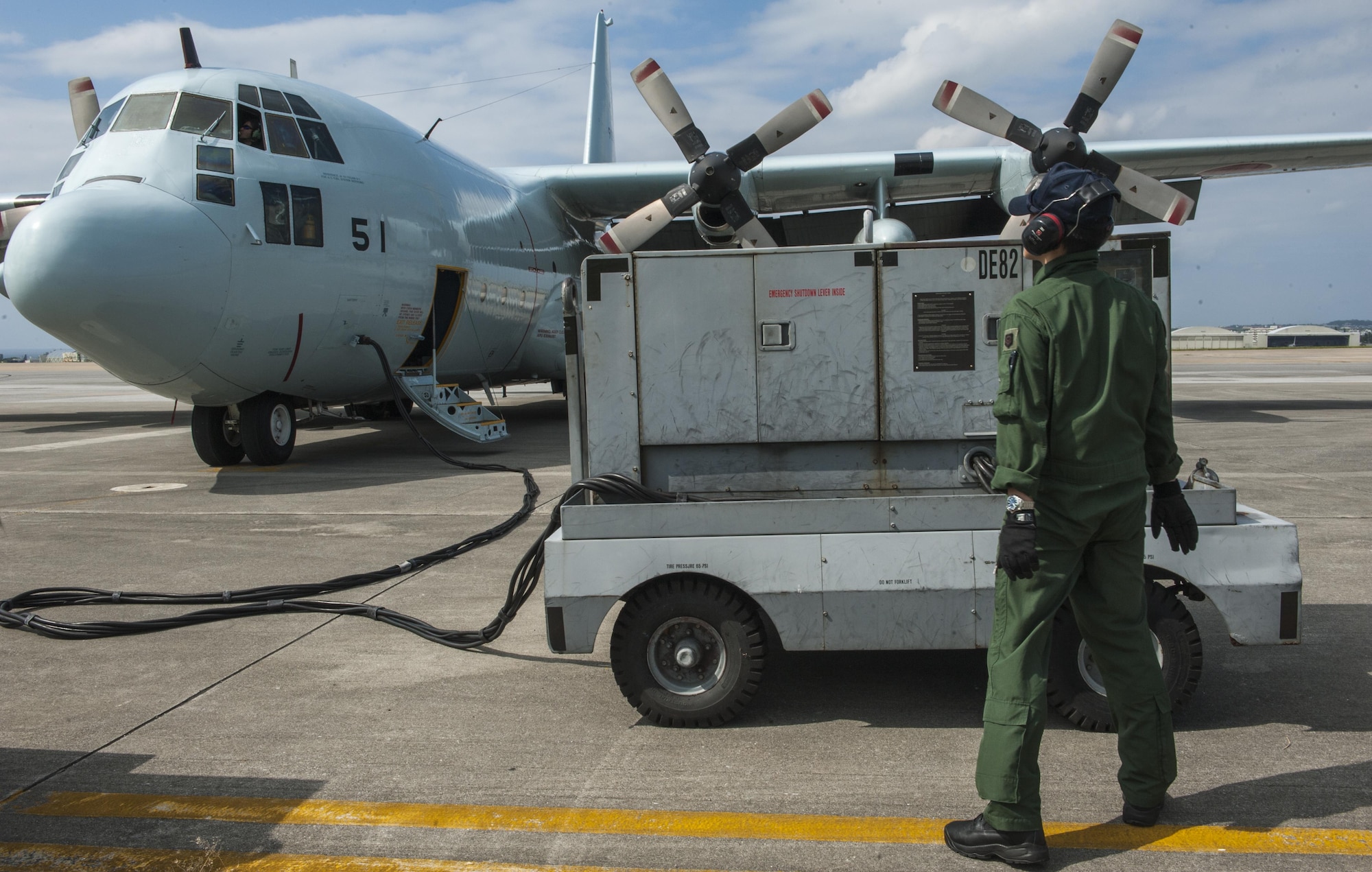 A member of the Japan Air Self-Defense Force operates a ground power unit for a JASDF C-130 Globemaster taking part in Exercise Keen Sword Oct. 30, 2016, on the flightline at Kadena Air Base, Japan. The operation was the culmination of weeks of coordination between the Government of Japan and the United States. (U.S. Air Force photo by Airman 1st Class Nick Emerick /Released) 