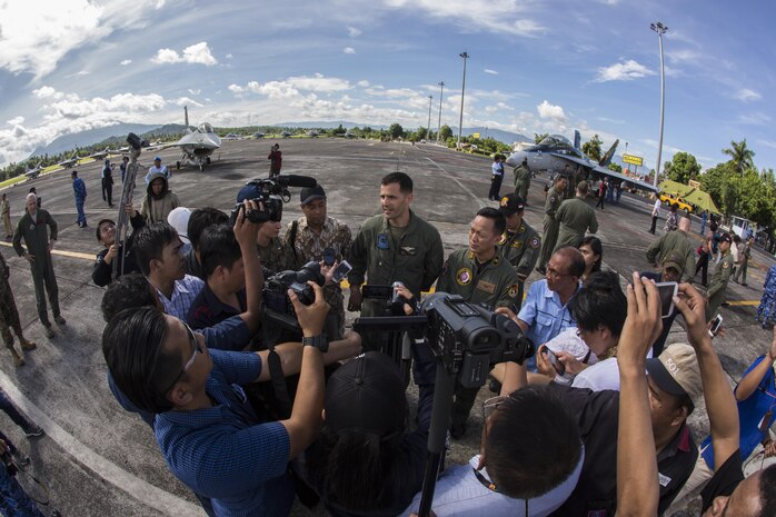 Indonesian media interview U.S. Marine Corps Lt. Col. Stephen N. McClune, commanding officer of Marine All-Weather Fighter Attack Squadron (VMFA (AW)) 225, as part of an opening ceremony to mark the beginning of exercise Cope West 17 at Sam Ratulangi International Airport, Indonesia, Nov. 1, 2016. Cope West 17 is the first exercise held in Indonesia in 19 years involving U.S. Marines and the Indonesian Air Force. (U.S. Marine Corps photo by Cpl. Aaron Henson)