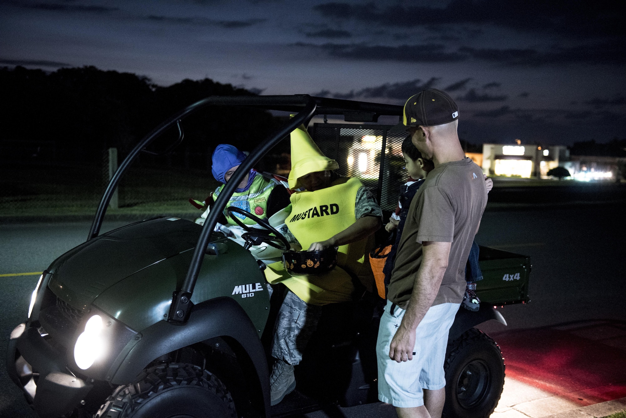 Volunteers stationed on Kadena Air Base, Japan, patrol the streets during Halloween, Oct. 31, 2016, at Kadena Air Base. The Pumpkin Patrol, a volunteer group, ensures trick or treaters remain safe during Halloween. (U.S. Air Force photo by Senior Airman Omari Bernard/Released)