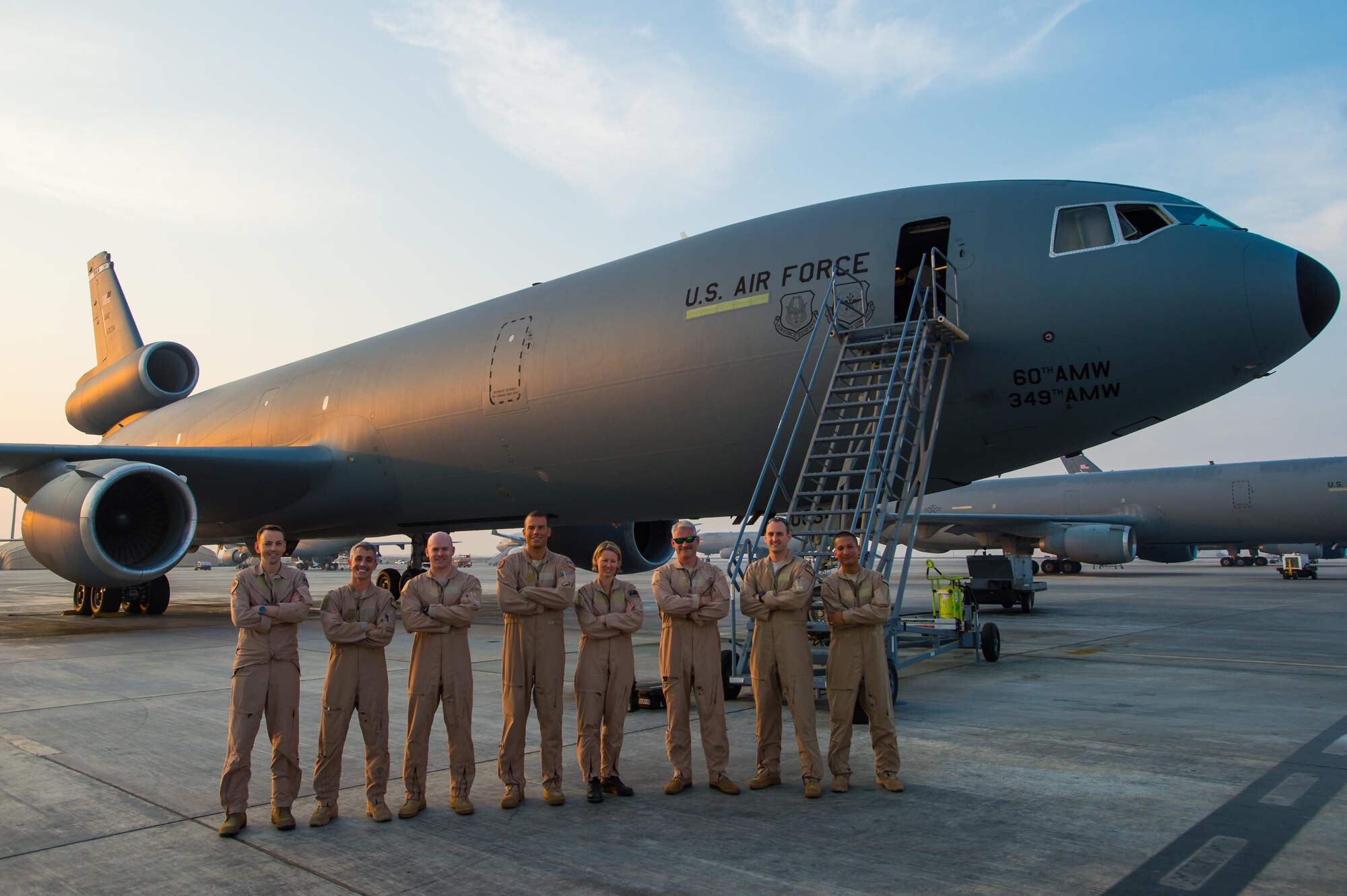 A U.S. Air Force KC-10 Extender crew and a Royal Australian Air Force KC-30A crew pose for a photo after completing the first ever coalition formation departure at an undisclosed location in Southwest Asia, Oct. 25, 2016. Between the two aircraft, they had the capability to collectively travel more than 20,000 miles in a joint effort to refuel allied air craft in support of the liberation of Mosul, Iraq. (U.S. Air Force photo by Senior Airman Tyler Woodward)