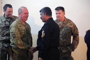 Australian Brig. Gen. Roger Noble, deputy commanding general for Combined Joint Forces Land Component Command – Operation Inherent Resolve, greets an Iraqi police officer after a joint press conference at Makhmur, Iraq, Nov. 1, 2016. Reporters were updated about the ongoing operations in the fight against ISIL. (U.S. Army photo by Spc. Ian Ryan)