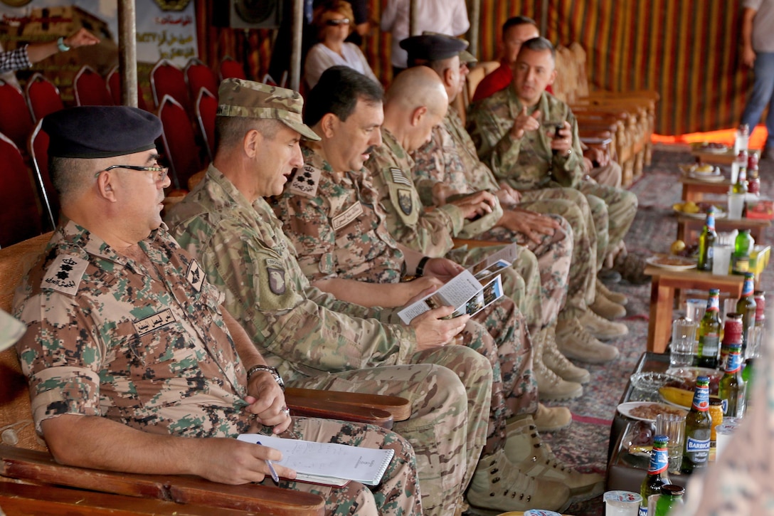 U.S. Army Maj. Gen. William Hickman (second from left), USARCENT Deputy Commanding General-Operations, Jordanian Army Brig. Gen. At-Tallah Smiran (third from left), Jordanian Armed Forces Artillery Director, and other senior military leaders wait to observe a combined live-fire exercise October 25, 2016. The Jordanian Army’s 29th Royal HIMARS Battalion welcomed the senior military leaders to observe the culminating exercise after weeks of working side-by-side with the U.S. Army’s 3rd Battalion, 321st Field Artillery Regiment.