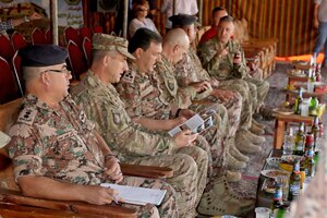 U.S. Army Maj. Gen. William Hickman (second from left), USARCENT Deputy Commanding General-Operations, Jordanian Army Brig. Gen. At-Tallah Smiran (third from left), Jordanian Armed Forces Artillery Director, and other senior military leaders wait to observe a combined live-fire exercise October 25, 2016. The Jordanian Army’s 29th Royal HIMARS Battalion welcomed the senior military leaders to observe the culminating exercise after weeks of working side-by-side with the U.S. Army’s 3rd Battalion, 321st Field Artillery Regiment.