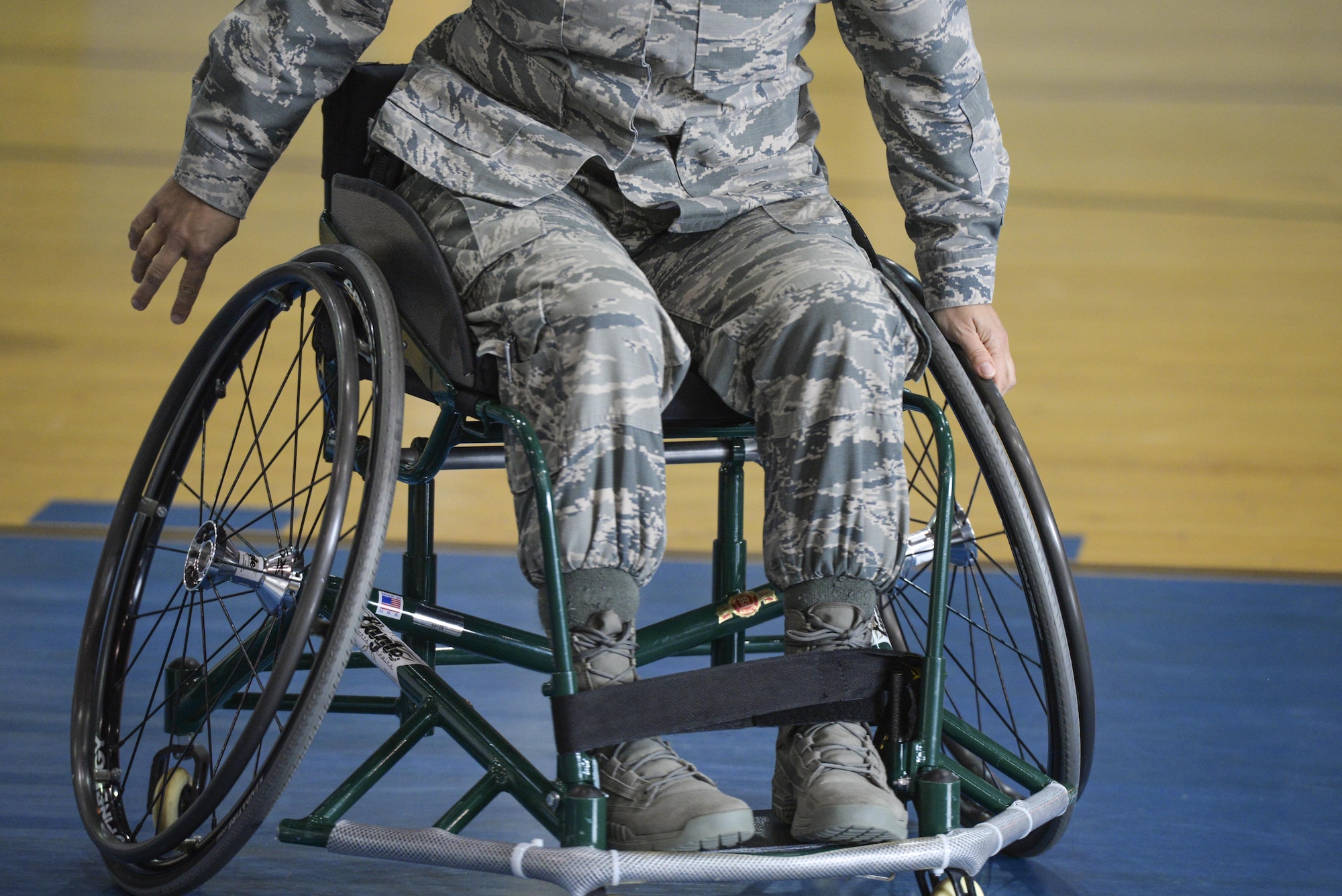 Service members participate in the 2nd annual wheelchair basketball game held as part of the National Disability Awareness Month activities, Oct. 26, at Wright-Patterson Air Force Base. In addition to military members, civilians from around the base were able to play an exhibition game against four members from the Miami Valley Raptors and feel what it is like to play this popular sport while bound to a wheelchair. (U.S. Air Force photo/ Wesley Farnsworth)