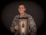 U.S. Air Force Staff Sgt. Thereasa Barker-Figueroa from the New Jersey Air National Guard's 108th Wing holds her 2016 Military Meritorious Service Award she was presented by the Society of American Indian Government Employees, Joint Base McGuire-Dix-Lakehurst, N.J., Oct. 4, 2016. Barker-Figueroa traces her lineage to the Lenni-Lenape, a group of Native American people from the Algonquin nation who populated New Jersey as well as parts of Pennsylvania and New York. 