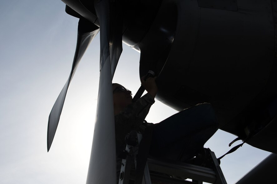Senior Airman Colleen Sweeney-Marple, a 386th Expeditionary Aircraft Maintenance Squadron assistant dedicated crew chief, inspects an EC-130 Compass Call at an undisclosed location in Southwest Asia Nov. 1, 2016. Senior Airman Colleen Sweeney-Marple is deployed from the 755th Aircraft Maintenance Squadron at Davis-Monthan Air Force Base, Ariz. (U.S. Air Force photo by Senior Airman Andrew Park/Released)