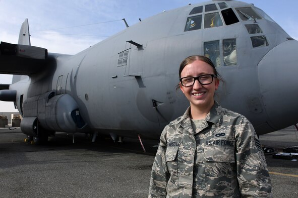 Senior Airman Colleen Sweeney-Marple poses in front of an C-130H Compass Call at an undisclosed location in Southwest Asia Nov. 1, 2016. Sweeney-Marple is deployed from the 755th Aircraft Maintenance Squadron at Davis-Monthan Air Force Base, Ariz. (U.S. Air Force photo by Senior Airman Andrew Park/Released)
