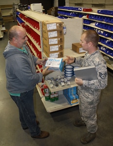 Bobby Coleman, Contractor Operated Civil Engineer Supply Store branch manager, assists SSgt. Owen, 633d Civil Engineering Squadron water and fuel systems craftsman, find materials at the self-help store at Joint Base Langley-Eustis, Va., Oct. 17, 2016. Facility managers, who need materials and tools for minor office and building repair, can use the self-help store and receive discounted prices and can avoid losing valuable time driving off-base to hardware stores. (U.S. Air Force photo by Mark Todd) 
