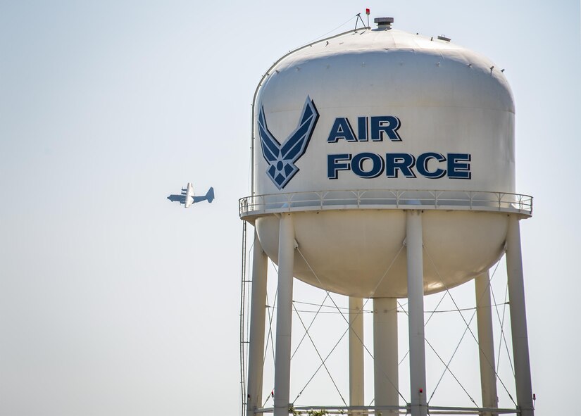 A C-130 passes by a water tower while performing approaches to the runway at Eglin Air Force Base, Fla., Nov. 1.  (U.S. Air Force photo/Samuel King Jr.)