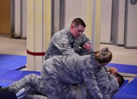 Staff Sgt. Adam Dederick, 50th Security Forces Squadron, provides instruction during combatives training at Schriever Air Force Base, Colorado, Monday, Oct. 31, 2016. The training focused on restraint and escape techniques. (U.S. Air Force photo/Brian Hagberg)
