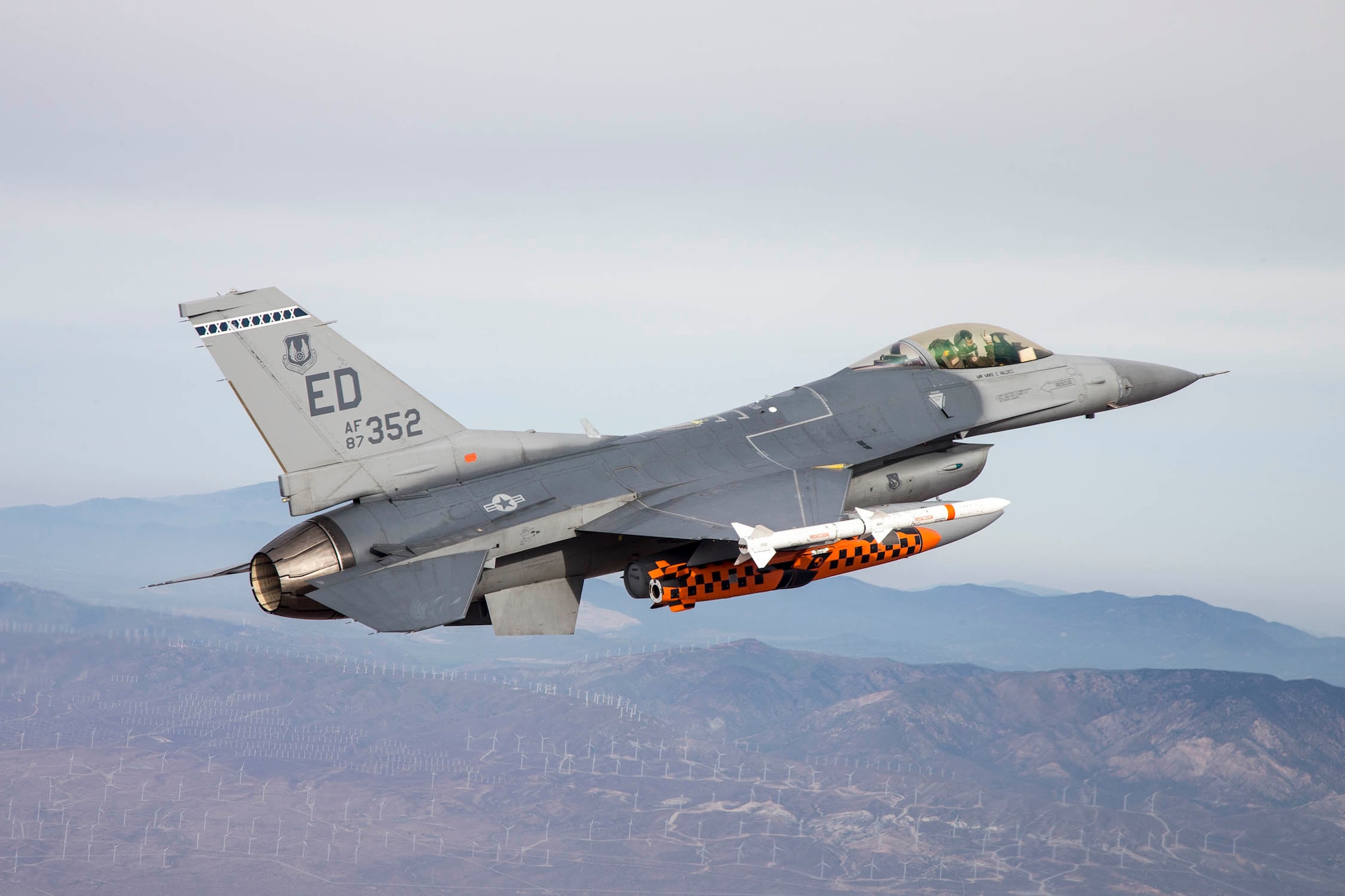 A U.S. Air Force F-16 Fighting Falcon piloted by Maj. Jameel Janjua of the Royal Canadian Air Force carries a developmental test version of the Joint Strike Missile to its release point above the Utah Test and Training Range west of Salt Lake City, Utah. When development is complete, the Joint Strike Missile is intended for use aboard the F-35 Lighting II Joint Strike Fighter. Janjua is assigned to the 416th Flight Test Squadron based at Edwards as part of an officer exchange program. (U.S. Air Force photo by Christopher Okula)