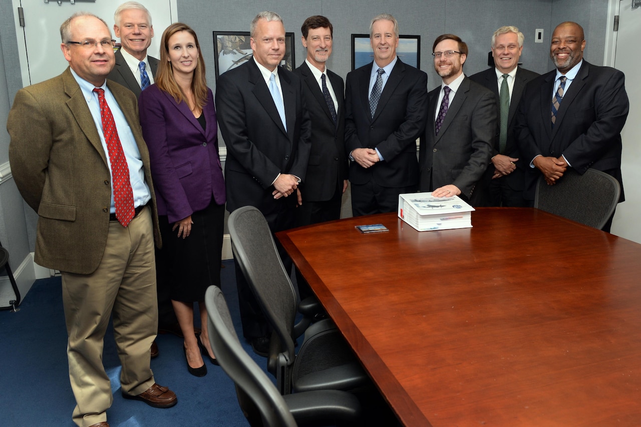 Director of cost Assessment and Program Evaluation Jamie Morin, third from left, stands with Pentagon and contractor Lockheed Martin representatives after a briefing about a new jointly developed F-35 cost tracking software at the Pentagon in Arlington, Va. Nov. 1, 2016. (DoD photo by EJ Hersom)
