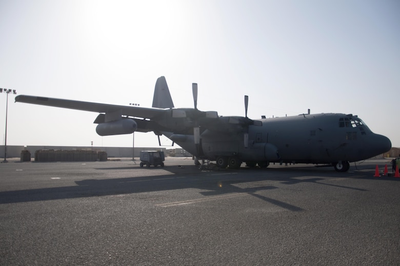 Crew members perform maintenance on a EC-130H Compass Call in an undisclosed location in Southwest Asia, Oct. 20, 2016. The EC-130 conducts electronic warfare, a highly specialized and unique mission that enables the 386th Air Expeditionary Wing to deliver decisive airpower. (U.S. Air Force photo by Master Sgt. Anika Jones/Released)