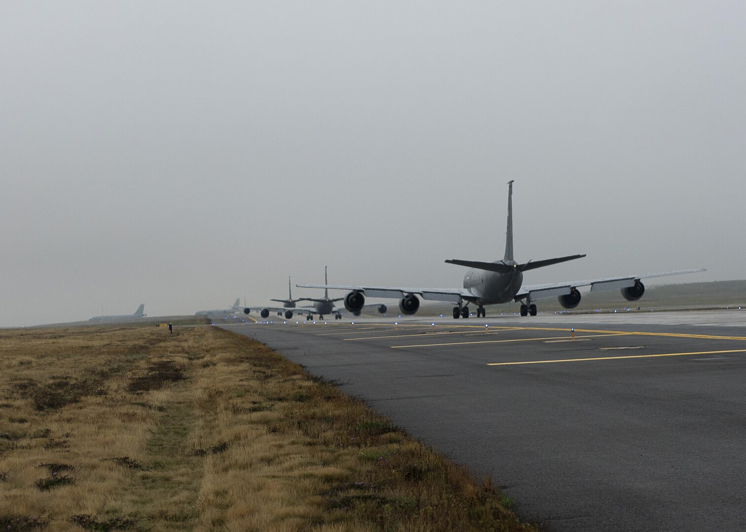 Five KC-135R Stratotankers from the 92nd Air Refueling Squadron make a line on the runway at Fairchild Air Force Base, Wash., Oct. 30, 2016. The KC-135 can do more than refuel, as it is also capable of transporting litter and ambulatory patients using patient support pallets during aeromedical evacuations. (U.S. Air Force photo by Airman 1st Class Ryan Lackey)