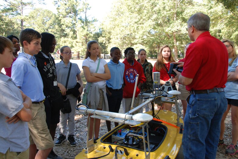 CHL’s Thad Pratt shows off his “souped-up” version of a remote-controlled boat that is used for collecting data for the Field Data Collection and Analysis Branch.