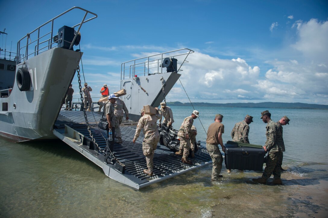 Navy Seabees, Marines and Cambodian sailors load equipment onto an amphibious landing craft at the beginning of Cooperation Afloat Readiness and Training Cambodia 2016 in Sihanoukville, Cambodia, Nov. 2, 2016. The Seebees are assigned to Naval Mobile Construction Battalion 5 and the Marines are assigned to 3rd Battalion, 2nd Marine Regiment. The annual maritime training involves the U.S. Navy and Marine Corps, and the armed forces of nine partner nations, including Bangladesh, Brunei, Cambodia, Indonesia, Malaysia, the Philippines, Singapore, Thailand and Timor-Leste. Navy photo by Chief Petty Officer Lowell Whitman