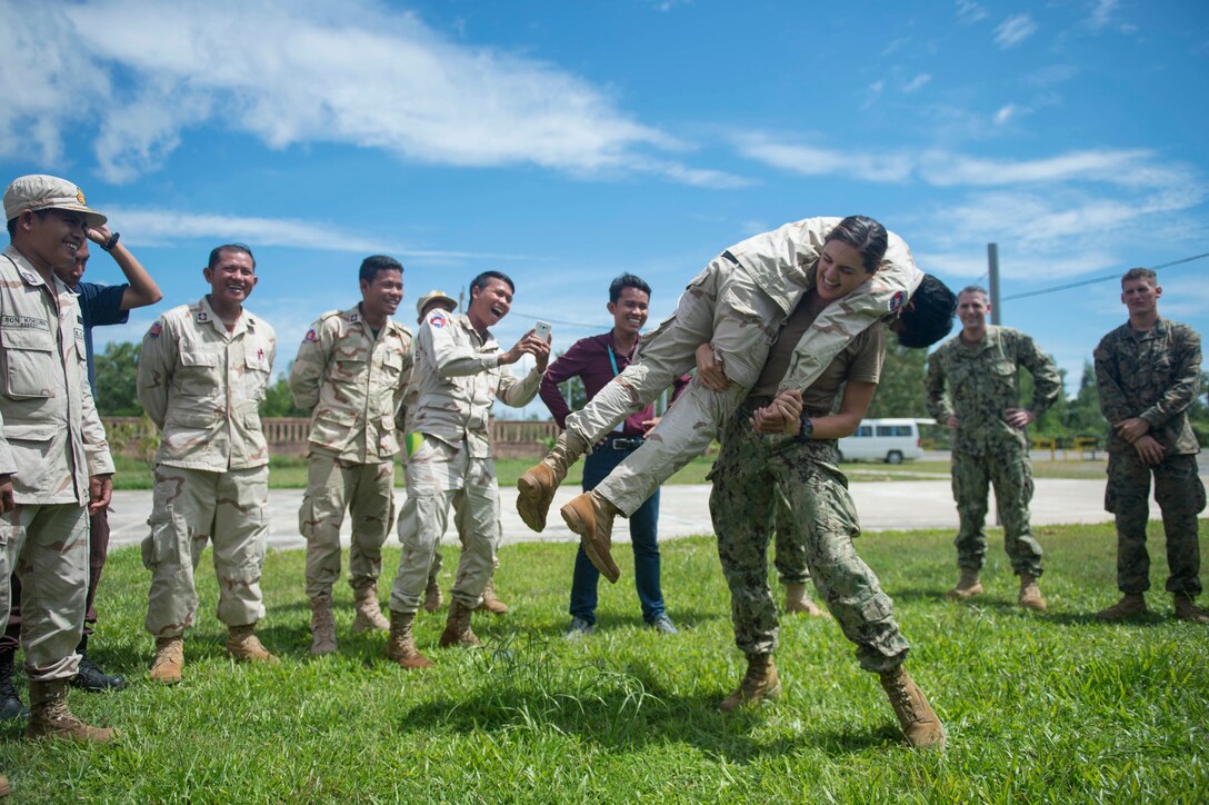 U.S. Navy Lt. Rachael Hayden lifts a Cambodian sailor into a fireman’s carry during first responder training for Cooperation Afloat Readiness and Training Cambodia 2016 in Sihoukville, Cambodia, Nov. 2, 2016. Navy photo by Chief Petty Officer Lowell Whitman