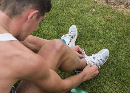 Cadet Andrew Milliron removes his chip after running in the Mountain West Conference Championship Oct. 28, 2016, at the Falcon Crest Golf Club in Kuna, Idaho. Milliron placed 29th overall out of 66 runners in the eight-kilometer course in 25 minutes, 2.30 seconds. (U.S. Air Force photo by Airman 1st Class Chester Mientkiewicz/Released)