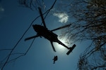 A 25th Combat Action Brigade (CAB) UH - 60 (black-hawk) conducts jungle penetration operations via air lift for a Defense POW/MIA Accounting Agency (DPAA) personnel on Sept. 27, 2016 in the Kualua Mountains of Oahu, HI. The 25th CAB conducted the jungle penetration in support of a Government operation on U.S. soil called 16-1US who's soul purpose is to locate a U.S. Navy pilot who went missing over 70 years ago. 