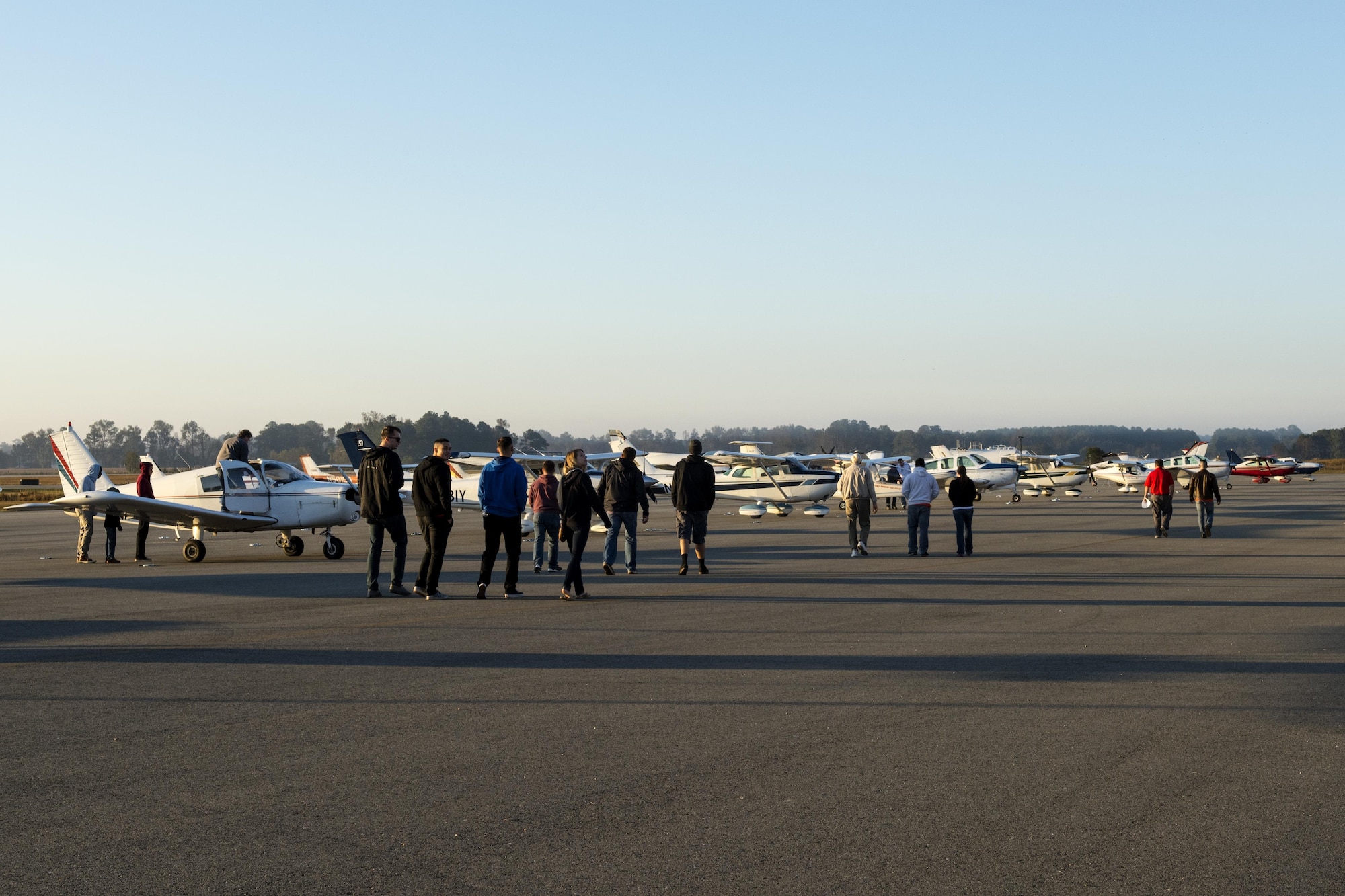 Airmen from the 4th Operations Support Squadron and their families familiarize themselves with the various aircraft they will be flying in for the annual Scare-a-Controller event, Oct. 29, 2016, at Wayne Executive Jetport in Goldsboro, North Carolina. More than 60 Airmen and their families received incentive rides during the event. (U.S. Air Force photo by Airman Shawna L. Keyes)