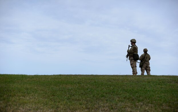 Airmen with the 5th Security Forces Squadron stand guard at Minot Air Force Base, North Dakota Oct. 28, 2016, in support of exercise Global Thunder 17.  Global Thunder is an annual training event that assesses command and control functionality in all U.S. Strategic Command mission areas and affords component commands a venue to evaluate their joint operational readiness. (U.S. Air Force photo by Tech. Sgt. Evelyn Chavez)