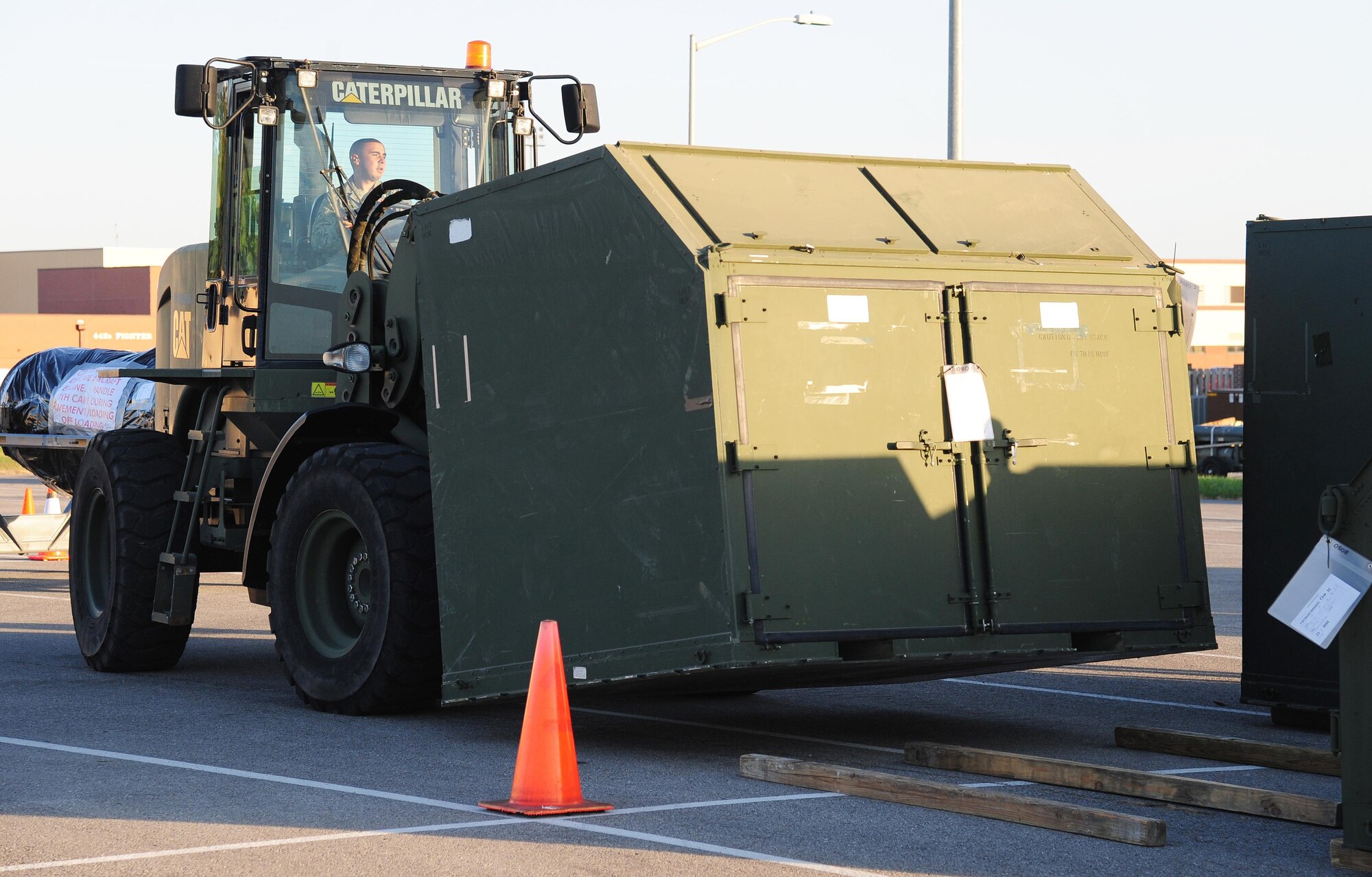 U.S. Air Force Airman Johnathan Snyder, a vehicle operator with the 509th Logistics Readiness Squadron, sets down a crate containing personal protective equipment during exercise Global Thunder 17 (GT17) at Whiteman Air Force Base, Mo., Oct. 24, 2016. GT17 is U.S. Strategic Command’s annual field training and battle staff exercise to train Department of Defense forces and assess joint operational readiness. (U.S. Air Force photo by Senior Airman Joel Pfiester)