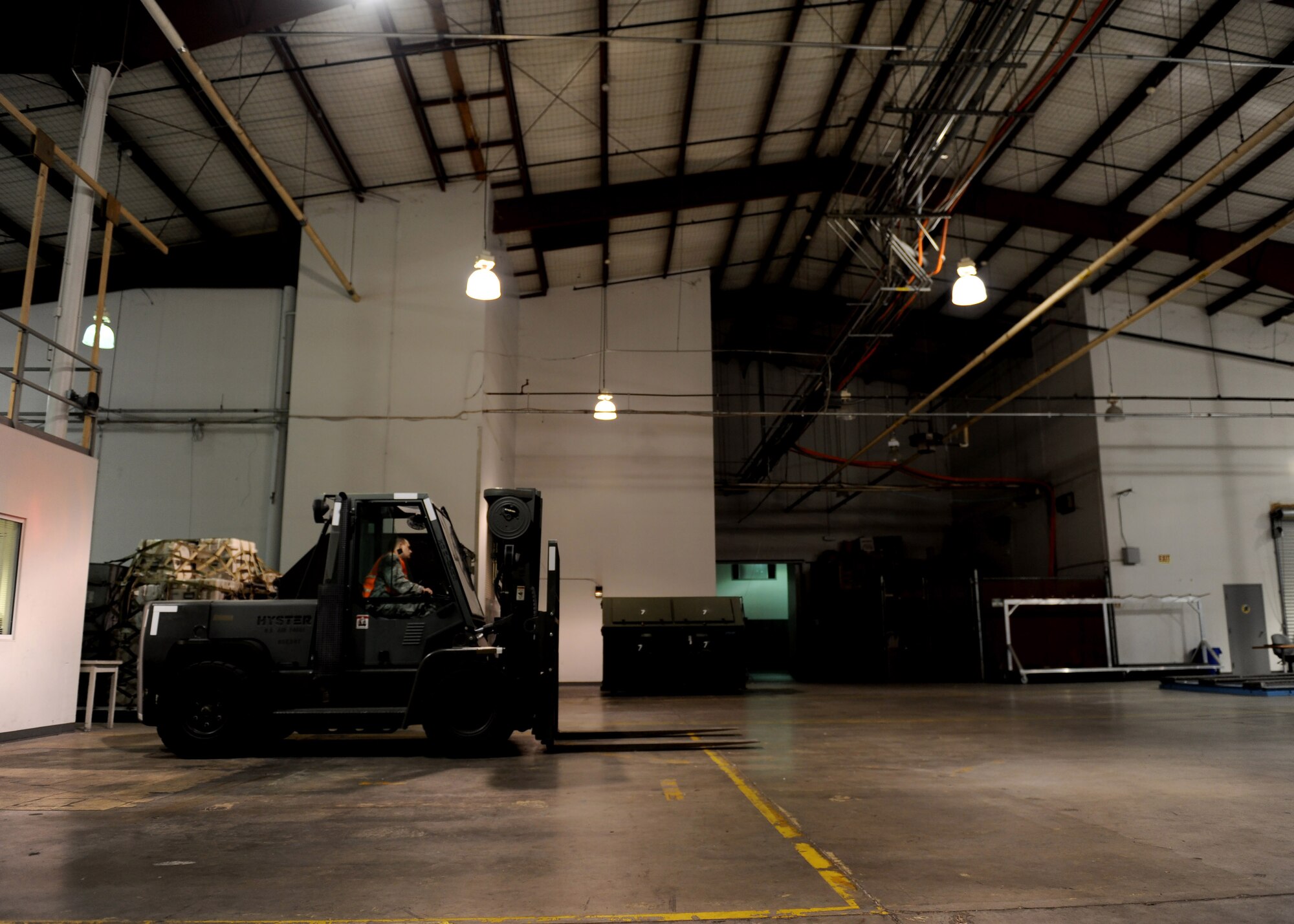 A 509th Logistics Readiness Squadron augumentee operates a forklift during Exercise Global Thunder 17 (GT17) at Whiteman Air Force Base, Mo., Oct. 25, 2016. The forklift is used to transfer cargo pallets from one location to another. GT17 is an invaluable training opportunity to exercise all U.S. Strategic Command mission areas and create the conditions for strategic deterrence against a variety of threats. (U.S. Air Force Senior Airman Danielle Quilla)