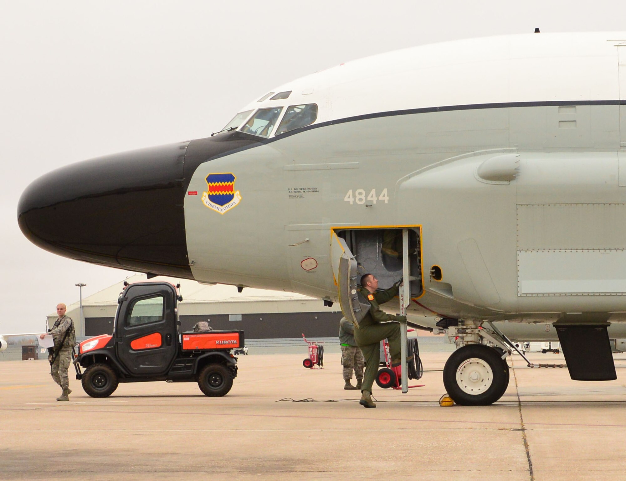 A Team Offutt Airman boards an RC-135 V/W Rivet Joint aircraft during Global Thunder 17, U.S. Strategic Command’s annual command post and field training exercise, Oct. 30, 2016, at Offutt Air Force Base, Neb. The exercise provided training opportunities for USSTRATCOM-tasked components, task forces, units and command posts to deter and, if necessary, defeat a military attack against the United States and to employ forces as directed by the President. (U.S. Air Force Photo by Drew Nystrom)