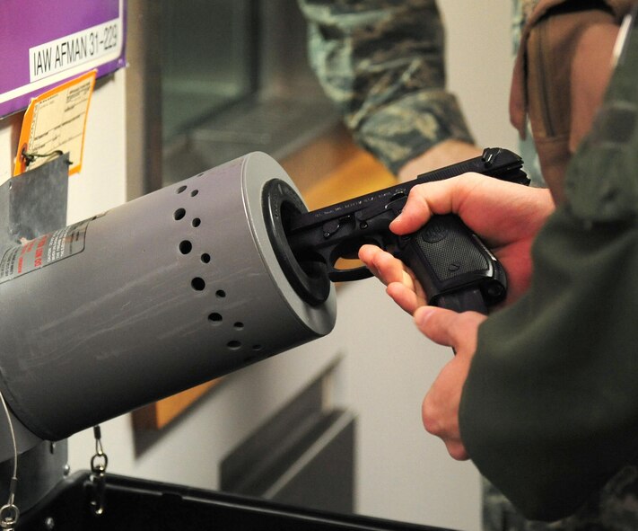 U.S. Air Force Capt. Daniel Welch, a B-2 Spirit pilot with the 13th Bomb Squadron, loads a magazine into an M9 pistol at the 509th Operations Support Squadron aircrew flight equipment shop during Exercise Global Thunder 17 at Whiteman Air Force Base, Mo., Oct. 25, 2016. Pilots are issued their weapons before stepping to their aircraft. (U.S. Air Force photo by Senior Airman Joel Pfiester)