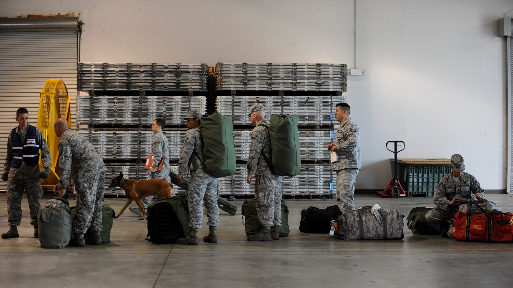 Members of chalk one arrive at the deployment center and prepare to go through the personnel deployment function line during Exercise Global Thunder 17 (GT17) at Whiteman Air Force Base, Mo., Oct. 26, 2016. GT17 is an annual command and control exercise designed to train U.S. Strategic Command forces and assess joint operational readiness. (U.S. Air Force by Senior Airman Danielle Quilla)