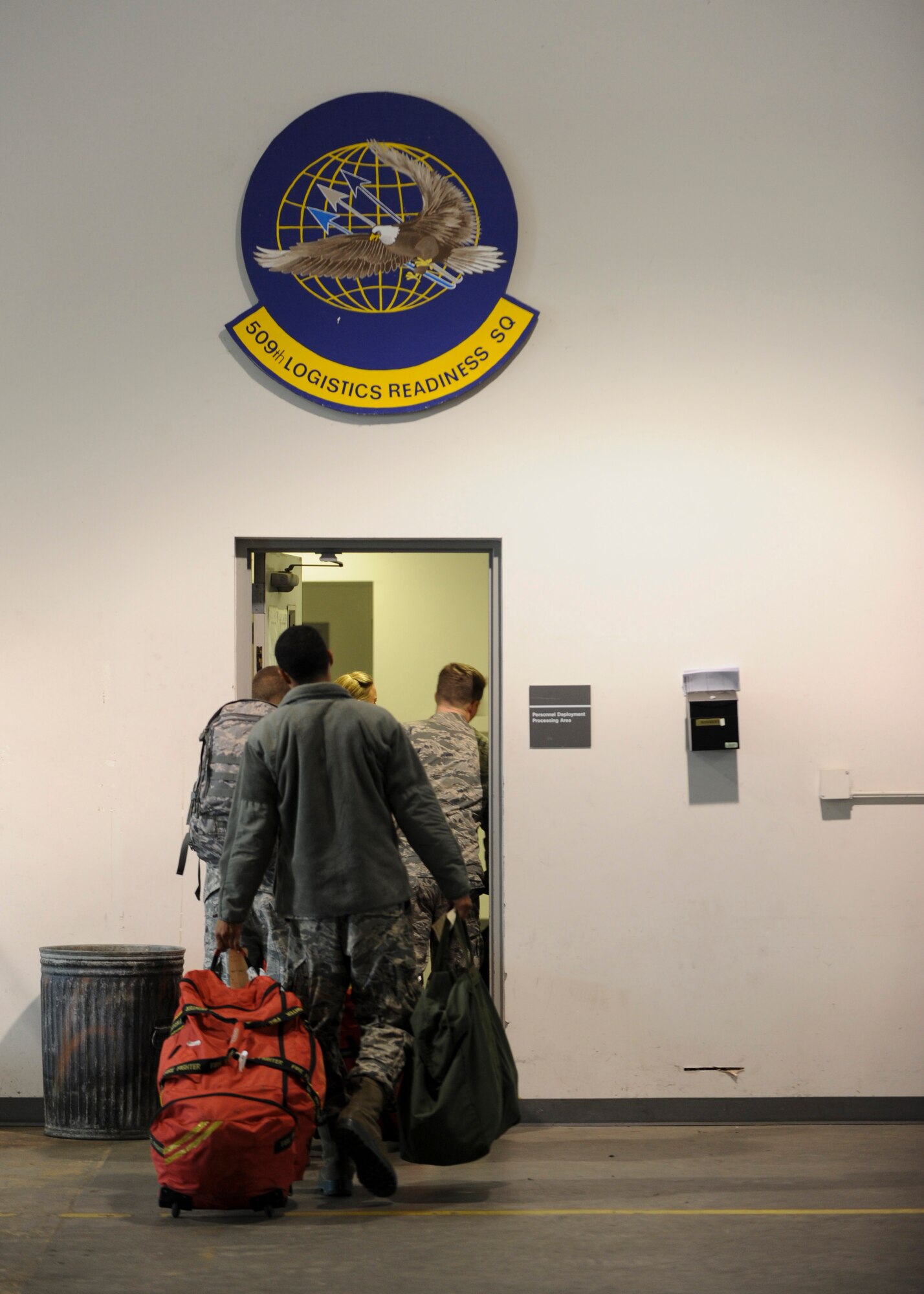 Members of chalk one walk toward the personnel deployment function (PDF) line during Exercise Global Thunder 17 (GT17) at Whiteman Air Force Base, Mo., Oct. 26, 2016. GT17 is an annual command and control exercise designed to train U.S. Strategic Command forces and assess joint operational readiness. (U.S. Air Force by Senior Airman Danielle Quilla)