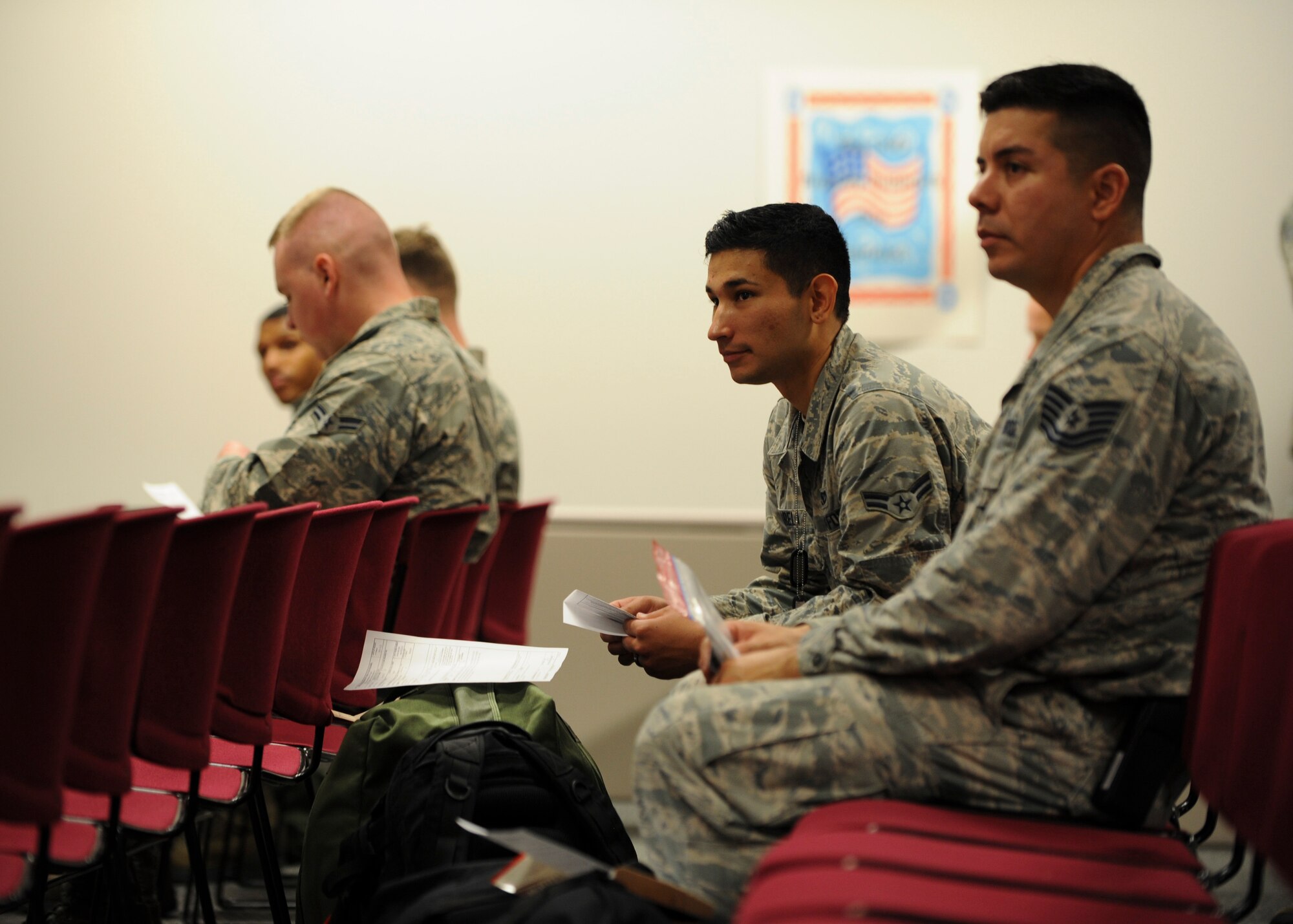 Members of chalk one wait to continue processing through the personnel deployment function (PDF) line during Exercise Global Thunder 17 (GT17) at Whiteman Air Force Base, Mo., Oct. 26, 2016. Exercises like GT17 test validate how U.S. Strategic Command assets maintain a safe, secure, effective and ready strategic deterrent force. (U.S. Air Force by Senior Airman Danielle Quilla)