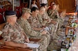 U.S. Army Maj. Gen. William Hickman (second from left), USARCENT Deputy Commanding General-Operations, Jordanian Army Brig. Gen. At-Tallah Smiran (third from left), Jordanian Armed Forces Artillery Director, and other senior military leaders wait to observe a combined live-fire exercise October 25, 2016. The Jordanian Army’s 29th Royal HIMARS Battalion welcomed the senior military leaders to observe the culminating exercise after weeks of working side-by-side with the U.S. Army’s 3rd Battalion, 321st Field Artillery Regiment.