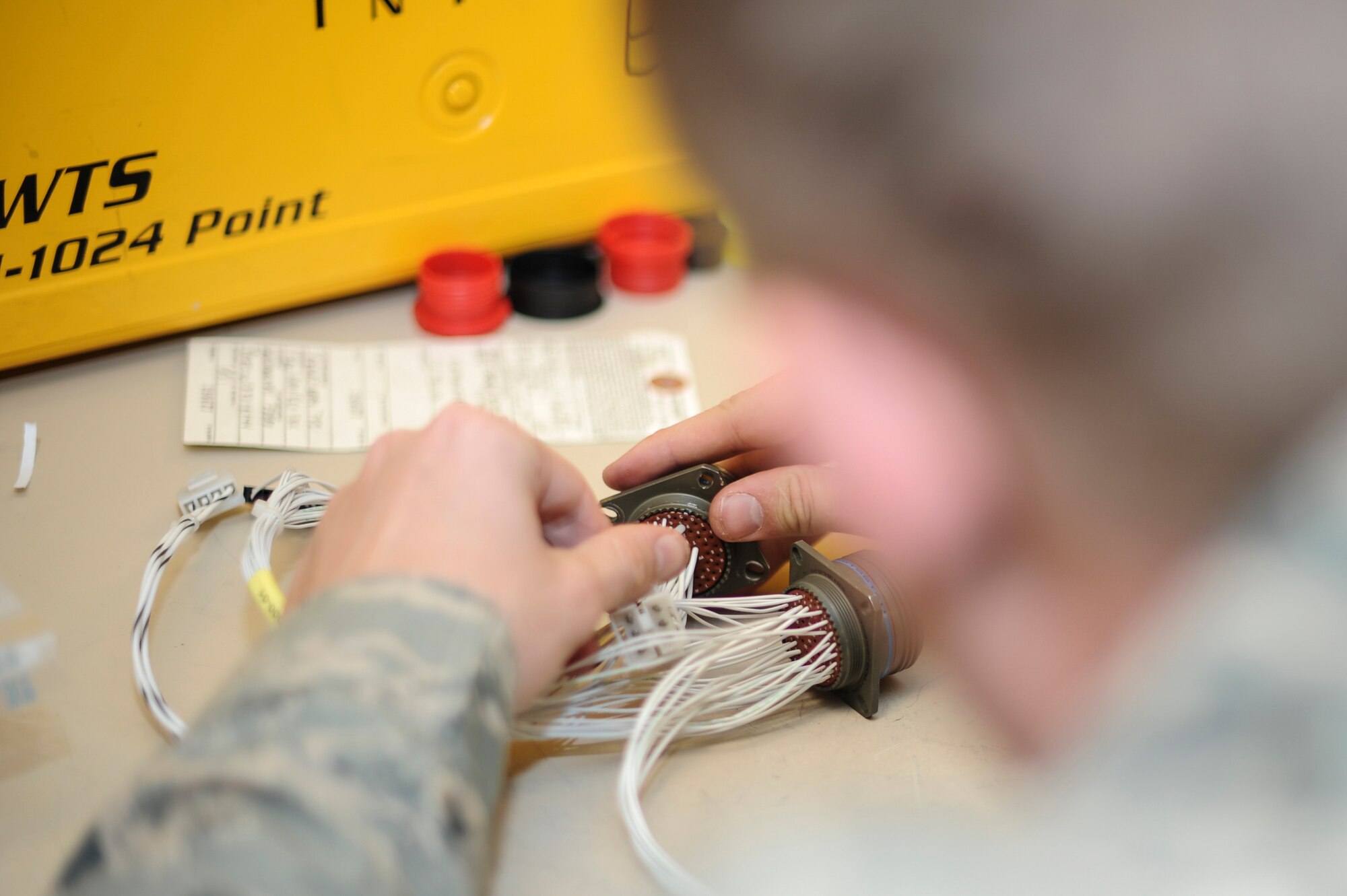 Senior Airman Ryan Rife, 355th Maintenance Group Air Force repair enhancement technician, repairs a burnt connector for an Armament shop tester used to function check weapons system components at Davis-Monthan Air Force Base, Ariz., Oct. 25, 2016. D-M’s AFREP avoided over a hundred thousand dollars in replacement costs. (U.S. Air Force photo by Airman 1st Class Mya M. Crosby)