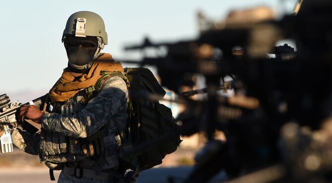 Airmen assigned to the 799th Security Forces Squadron complete weapon checks before beginning their field training exercise of a Fundamentals of Proficiency Fire and Close Quarters Battle course, Oct. 21, 2016, at Range 63C, Silver Flag Alpha, Nev. Recently, Airmen of the 799th SFS began tactical training to maintain mission readiness. (U.S. Air Force photo by Airman 1st Class James Thompson) 