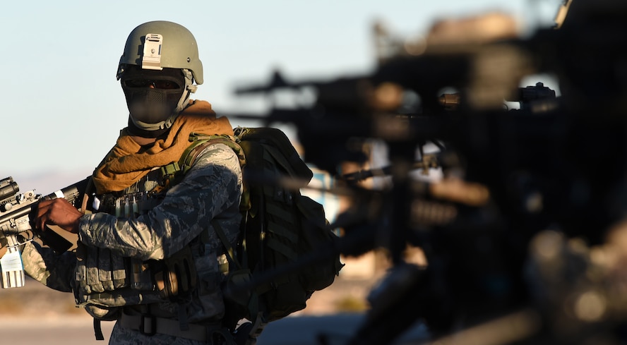 Airmen assigned to the 799th Security Forces Squadron complete weapon checks before beginning their field training exercise of a Fundamentals of Proficiency Fire and Close Quarters Battle course, Oct. 21, 2016, at Range 63C, Silver Flag Alpha, Nev. Recently, Airmen of the 799th SFS began tactical training to maintain mission readiness. (U.S. Air Force photo by Airman 1st Class James Thompson) 