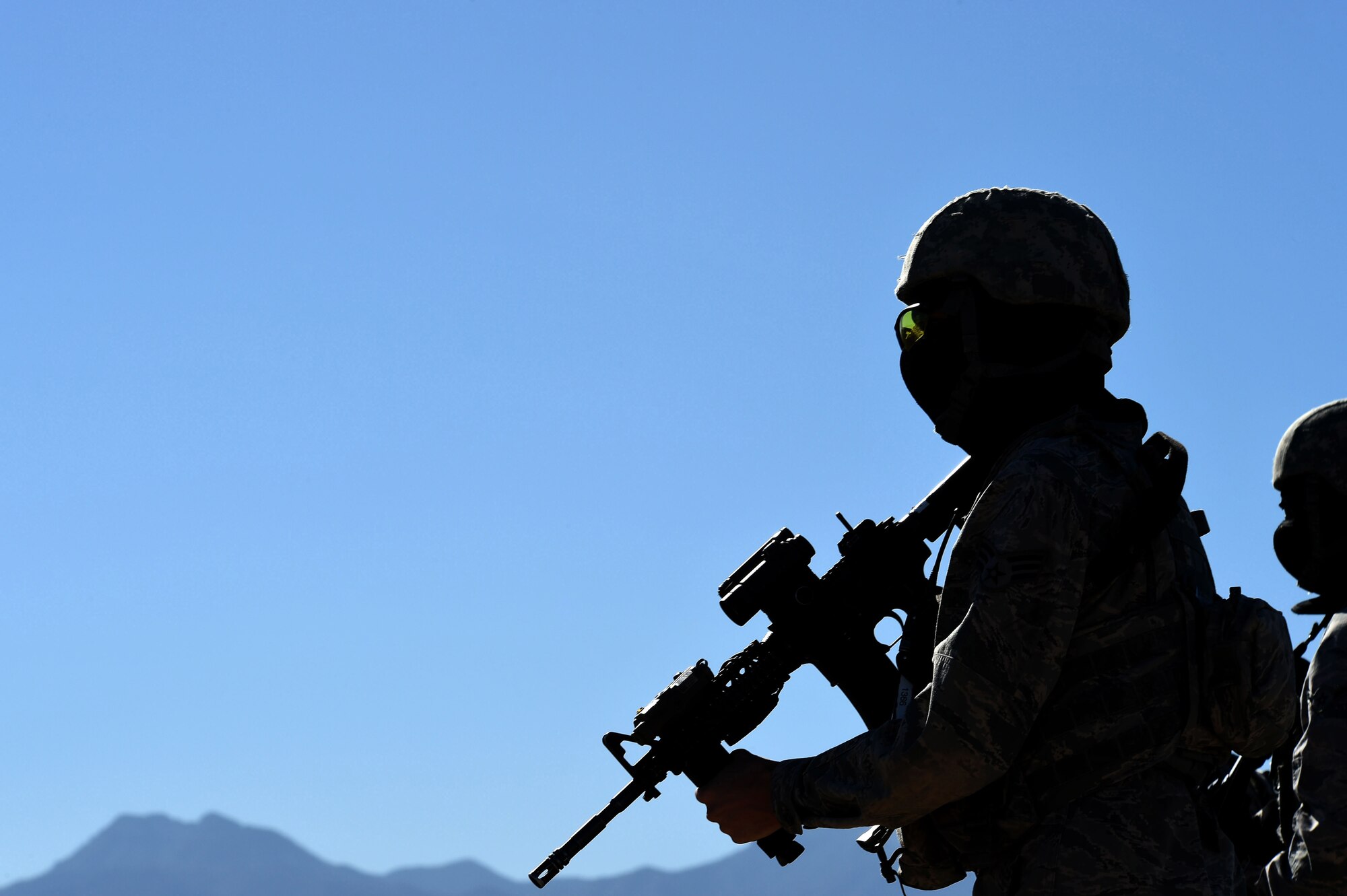 Airmen assigned to the 799th Security Forces Squadron travel to a designated training site to begin a field training exercise in a Fundamentals of Proficiency Fire and Close Quarters Battle course, Oct. 21, 2016, at Range 63C, Silver Flag Alpha, Nev. The unit was divided into Alpha, Bravo, and Charlie flights, each with designated squad and fire team leaders. (U.S. Air Force photo by Airman 1st Class James Thompson)  