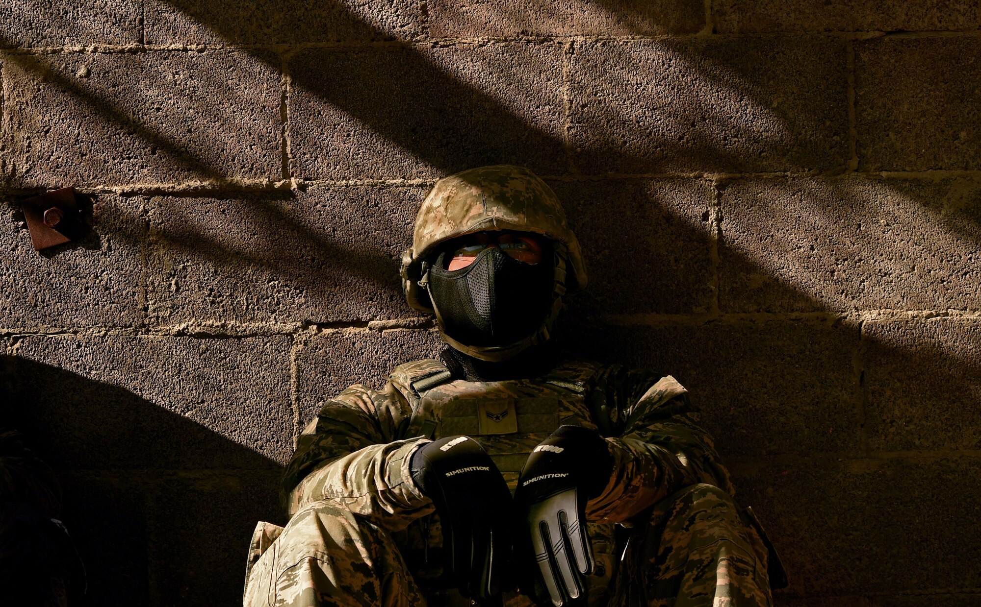 An Airman assigned to the 799th Security Forces Squadron rests after becoming a casualty during a simulated combat scenario, Oct. 21, 2016, at Range 63C, Silver Flag Alpha, Nev. The Airmen were tasked with planning and carrying out specific operation orders while mitigating collateral damage and neutralizing all opposing forces. (U.S. Air Force photo by Airman 1st Class James Thompson)