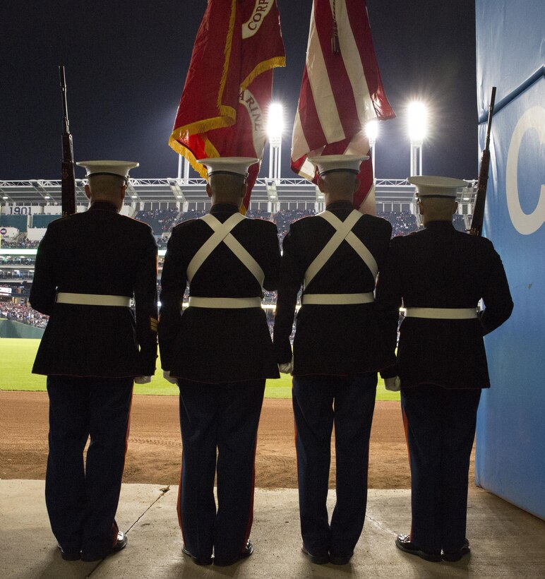 Marines from Headquarters Company, 3rd Battalion, 25th Marine Regiment, 4th Marine Division, stand ready to take the field and present the national colors at game one of the 2016 World Series at Progressive Field in Cleveland, Oct. 25, 2016. Just before the ceremony, announcer Bob Tyek gave credit to the Marine Corps Reserve and its 100 years of faithful service. Today, approximately 500 Reserve Marines are providing fully integrate global operational support to the Fleet and Combatant Commanders. For more information on the history and heritage of the Marine Corps Reserve as well as current Marine stories and upcoming Centennial events, please visit www.marines.mil/usmcr100. (U.S. Marine Corps photo by Lance Cpl. Dallas Johnson)