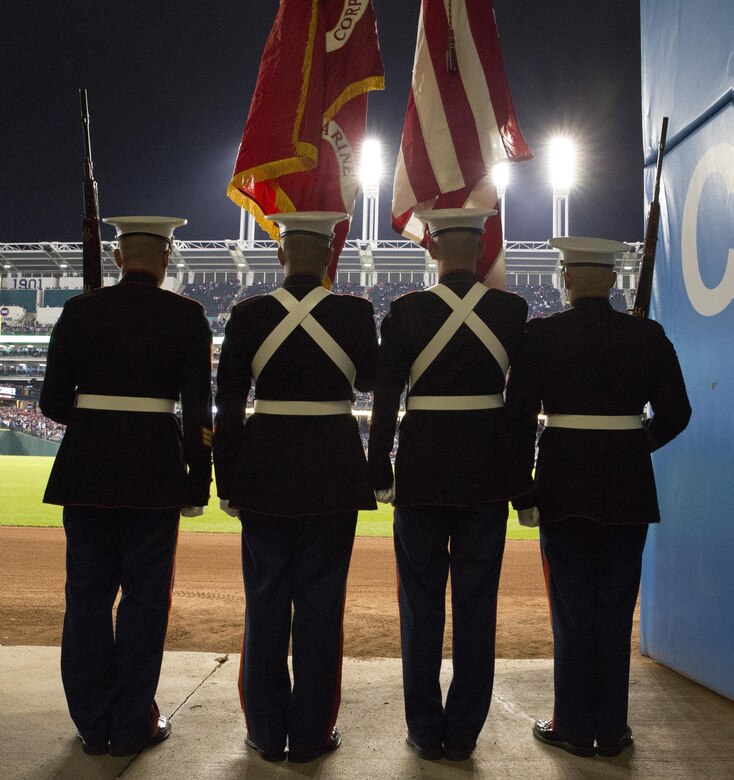 Marines from Headquarters Company, 3rd Battalion, 25th Marine Regiment, 4th Marine Division, stand ready to take the field and present the national colors at game one of the 2016 World Series at Progressive Field in Cleveland, Oct. 25, 2016. Just before the ceremony, announcer Bob Tyek gave credit to the Marine Corps Reserve and its 100 years of faithful service. Today, approximately 500 Reserve Marines are providing fully integrate global operational support to the Fleet and Combatant Commanders. For more information on the history and heritage of the Marine Corps Reserve as well as current Marine stories and upcoming Centennial events, please visit www.marines.mil/usmcr100. (U.S. Marine Corps photo by Lance Cpl. Dallas Johnson)