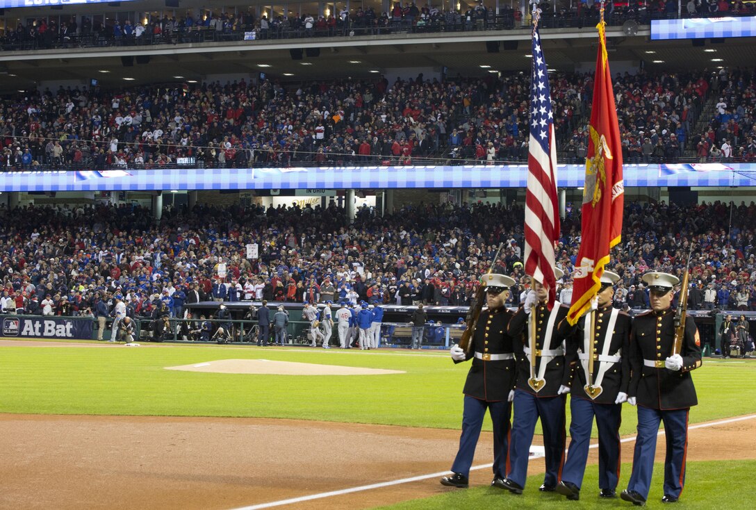 Marines from Headquarters Company, 3rd Battalion, 25th Marine Regiment, 4th Marine Division, complete the presentation of the National Colors at game one of the 2016 World Series at Progressive Field in Cleveland, Oct. 25, 2016. Just before the ceremony, announcer Bob Tyek gave credit to the Marine Corps Reserve and its 100 years of faithful service. Today, approximately 500 Reserve Marines are providing fully integrate global operational support to the Fleet and Combatant Commanders. For more information on the history and heritage of the Marine Corps Reserve as well as current Marine stories and upcoming Centennial events, please visit www.marines.mil/usmcr100. (U.S. Marine Corps photo by Lance Cpl. Dallas Johnson)