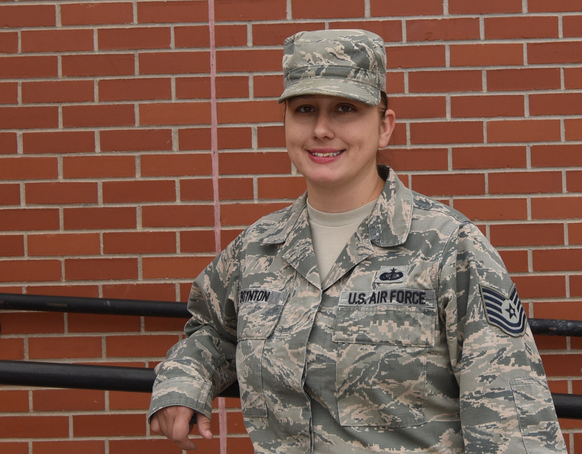 Tech Sgt. Nicole Boynton, 90th Force Support Squadron community center NCO in charge, poses outside of the Trail’s End at F.E. Warren Air Force Base, Wyo., Oct. 25, 2016. Boynton plays a large role in running the Trail’s End, which supports many base morale events, such as retirements, promotions, fun activities and more. (U.S. Air Force photo by Airman 1st Class Breanna Carter)