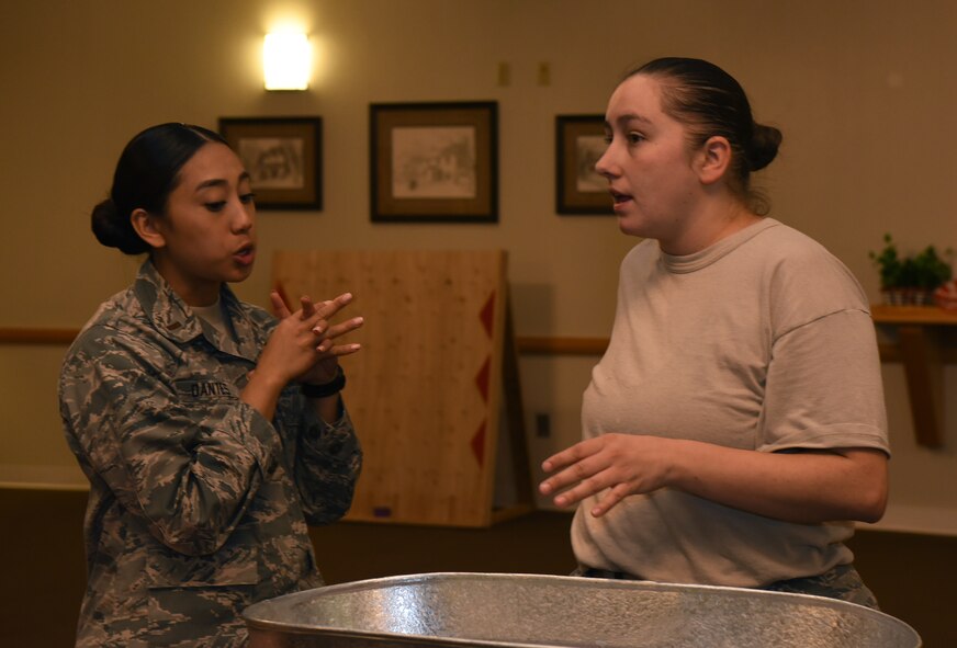 Tech Sgt. Nicole Boynton, 90th Force Support Squadron community center NCO in charge and 2nd Lt. Alyscia Dantes, 90th FSS community services deputy flight chief, discuss how to set up the ballroom in the Trail’s End at F.E. Warren Air Force Base, Wyo., Oct. 27, 2016. They were planning decorations for an upcoming event. (U.S. Air Force photo by Airman 1st Class Breanna Carter)