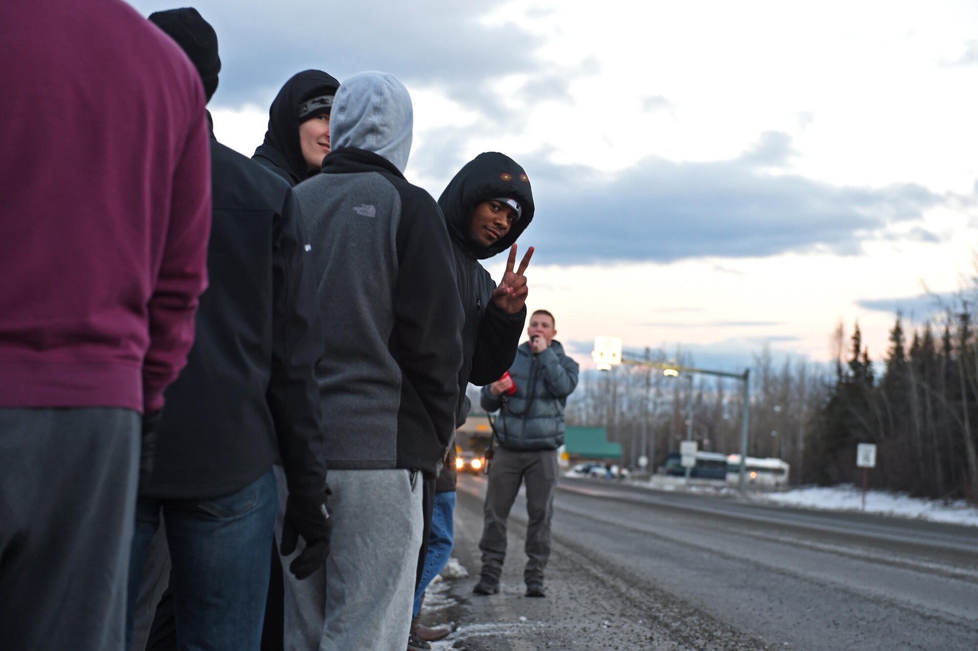 Protesters gather near Joint Base Elmendorf-Richardson as part of Polar Force 17-1, Nov. 1, 2016. The simulated protest began as a peaceful demonstration which escalated, resulting in a few aggressive protesters being detained and turned over to local law enforcement. The exercise tests the base's ability to integrate, mobilize, and prepare assigned personnel, aircraft and equipment for a wartime mission and to employ forces and weapons systems. 