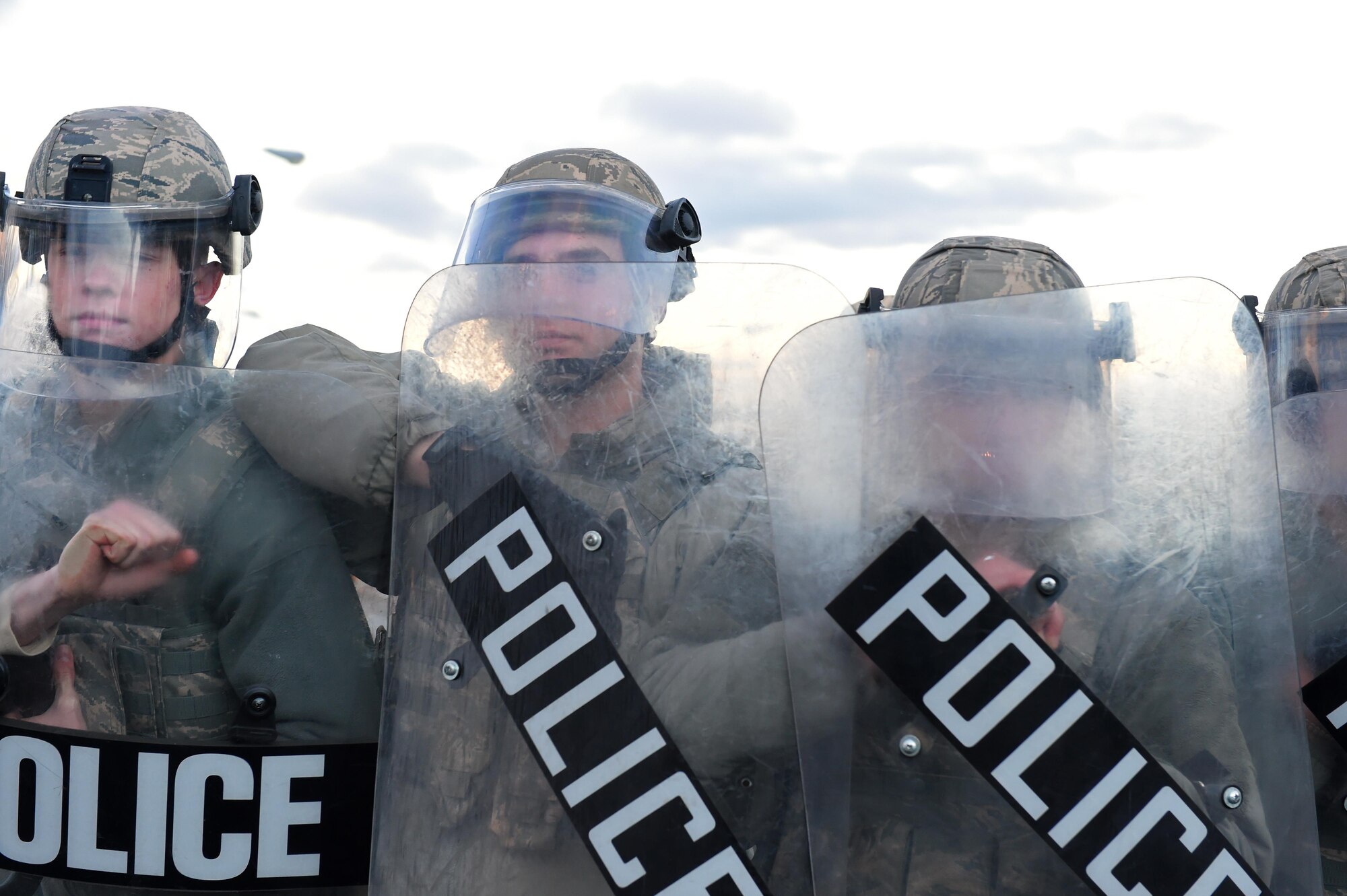 Joint Base Elmendorf-Richardson security forces personnel perform security operations during a simulated protest as part of exercise Polar Force 17-1 at JBER, Alaska, Nov. 1, 2016. The simulated protest began as a peaceful demonstration which escalated, resulting in a few aggressive protesters being detained and turned over to local law enforcement. The exercise tests the base's ability to integrate, mobilize, and prepare assigned personnel, aircraft and equipment for a wartime mission and to employ forces and weapons systems. 