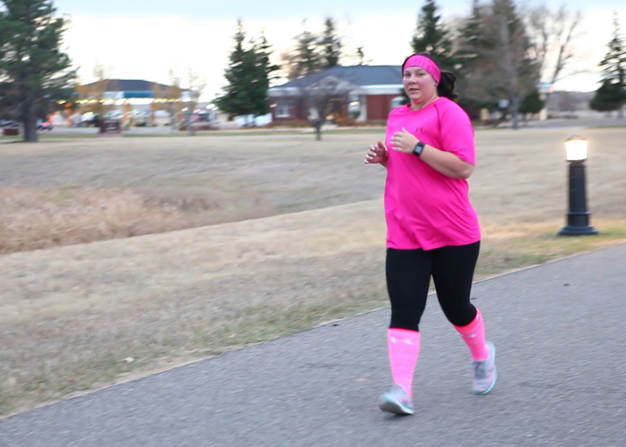 A participant of a Breast Cancer Awareness 2 mi. Run/Walk run on F.E. Warren Air Force Base, Wyo., October 25, 2016. The 90th Medical Group organized the run/walk and hosted a guest speaker later that week to commemorate October being Breast Cancer Awareness Month. (U.S. Air Force Photo by Lan Kim)
