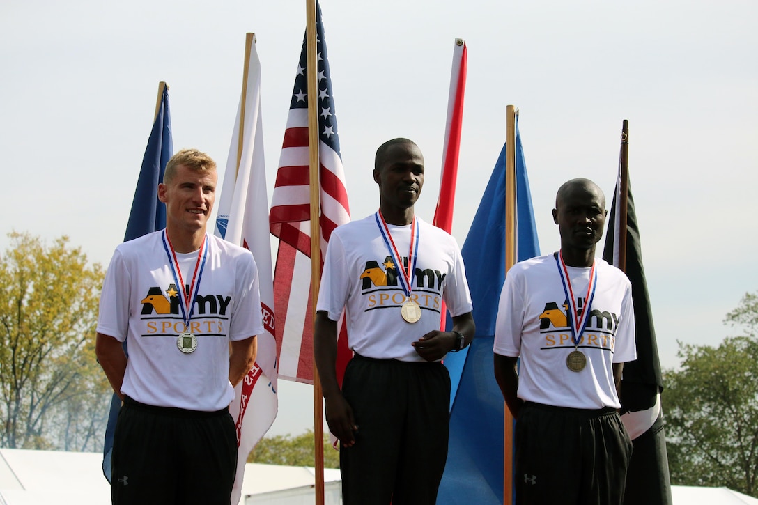 Army sweeps the podium of the Men's Individual Marathon Championship.  Left to right:  2nd Place: Capt. Kenneth Foster, Denver, Colo. - 2:28:02; 1st Place: SPC Samuel Kosgei, Fort Riley, Kan. - 2:23:53; 
3rd Place: Spc. David Kiplaget, Fort Carson, Colo. - 2:33:31. The 2016 Armed Forces Marathon is held in conjunction with the 41st Marine Corps Marathon on 30 October in Washington, D.C.