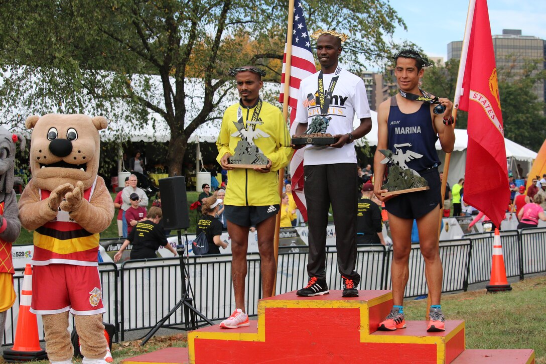 Army Spc. Samuel Kosgei (center) of Fort Riley, Kansas wins the Marine Corps Marathon for a second time with a time of 2:23:53. The 2016 Armed Forces Marathon is held in conjunction with the 41st Marine Corps Marathon on 30 October in Washington, D.C.