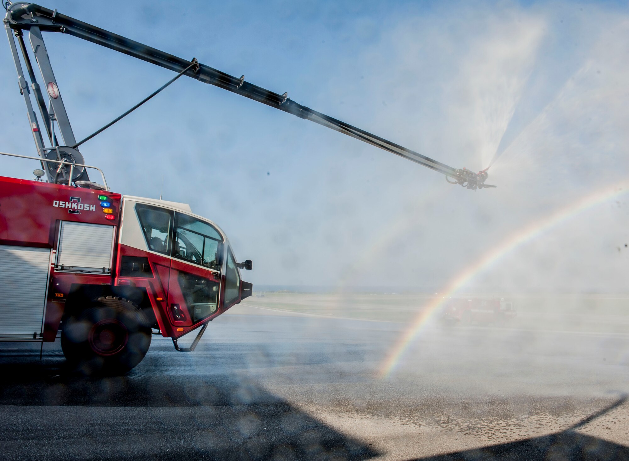 An 18th Civil Engineer Squadron Oshkosh Striker 6x6 tests its water boom Oct. 31, 2016, at Kadena Air Base, Japan. Oshkosh Striker 6x6s are special vehicles designed to put out aircraft fires and are capable of emitting 1,000 gallons of water within three minutes. (U.S. Air Force photo by Senior Airman Lynette M. Rolen)